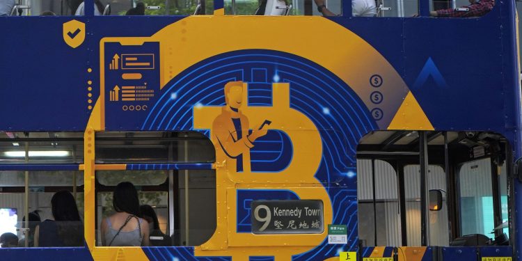 Bitcoin tops $66,000, sets record as crypto goes mainstream