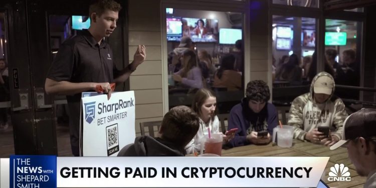 More businesses offer pay in cryptocurrency in a bid to lure young workers